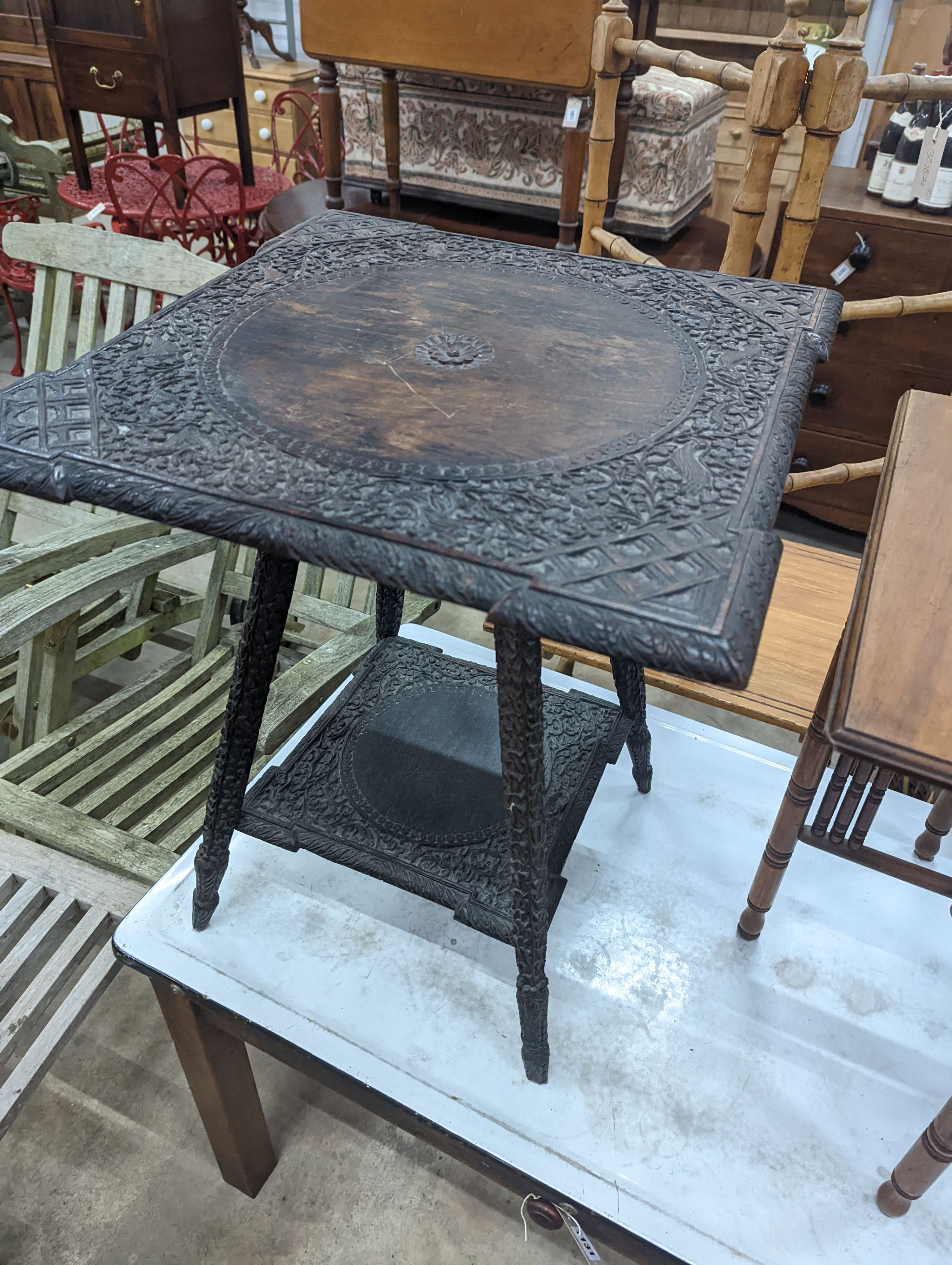 A carved Indian table and another, larger width 53cm, height 62cm